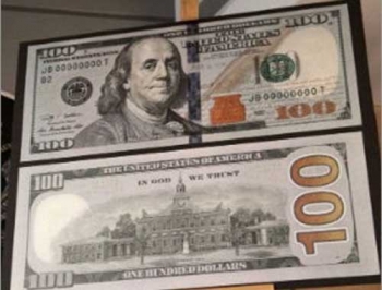 США вводят в обращение новую 100-долларовую купюру фото