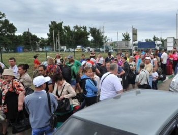 Переселенцы собираются домой из Запорожья фото