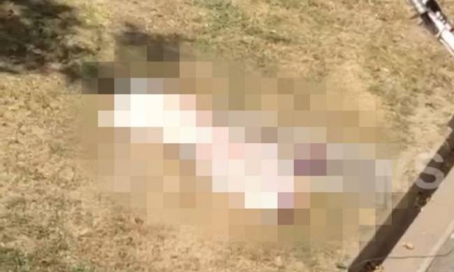Утром в Запорожье из окна выпала женщина, к обеду тело до сих пор лежит на земле фото